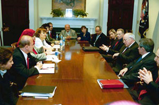 A photograph of V.P. Cheney meeting with Iraqi Americans and Iraqi Expatriates. A photograph of V.P. Cheney meeting with Iraqi Americans and Iraqi Expatriates.