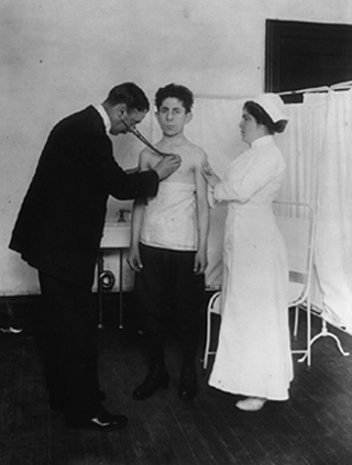 A black and white photograph of a man being examined by a doctor. A black and white photograph of a man being examined by a doctor.