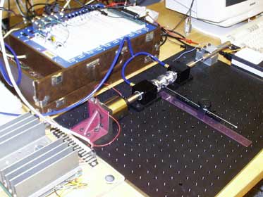 Figure 1. The second-order system, amplifier (bottom left) and breadboard (top).