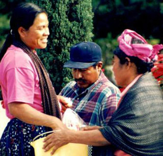 A Mexican woman selling her wares at a local market.