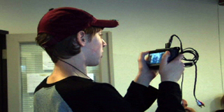 Student using wearable camera to capture in situ facial expressions.