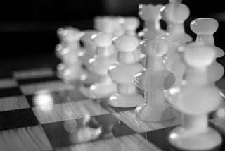 A photograph of a chess board. A photograph of a chess board.