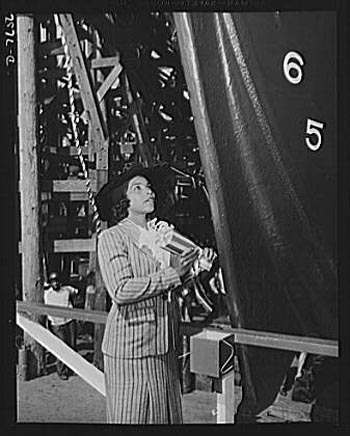 Production. Launching of the SS Booker T. Washington. Marian Anderson, celebrated contralto, prepares to christen the SS Booker T. Washington, talks to two Negro workmen who helped construct the first Liberty Ship named for a Negro, at the Wilmington yards of the California Shipbuilding Corporation.