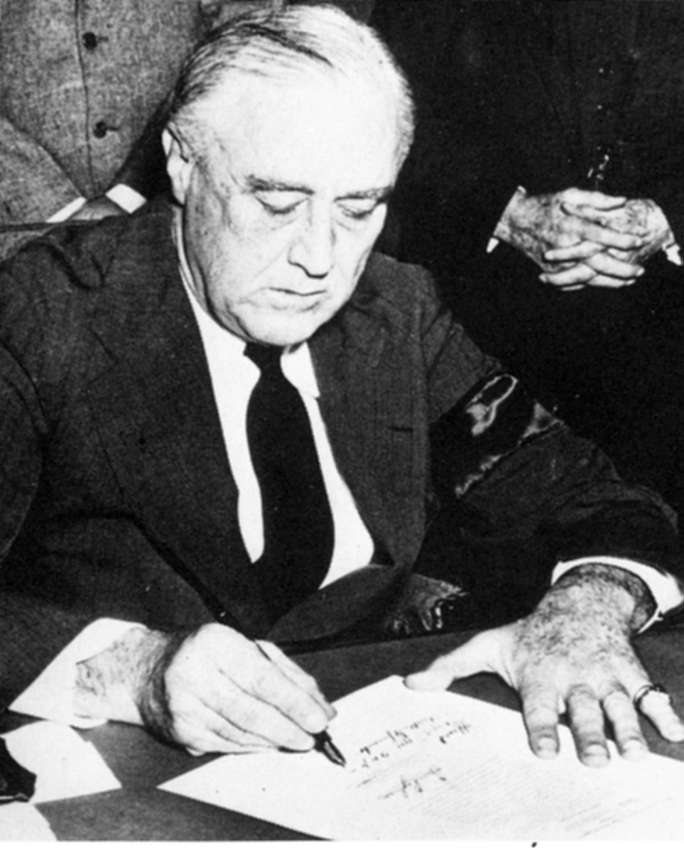 Roosevelt signing the declaration of war against Japan, December 8, 1941.
