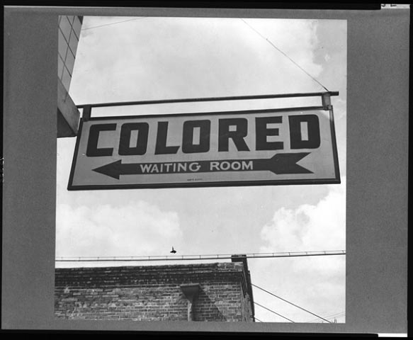 A hanging sign reads 'Colored Waiting Room'.