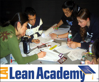 A photo of students working together at a table.